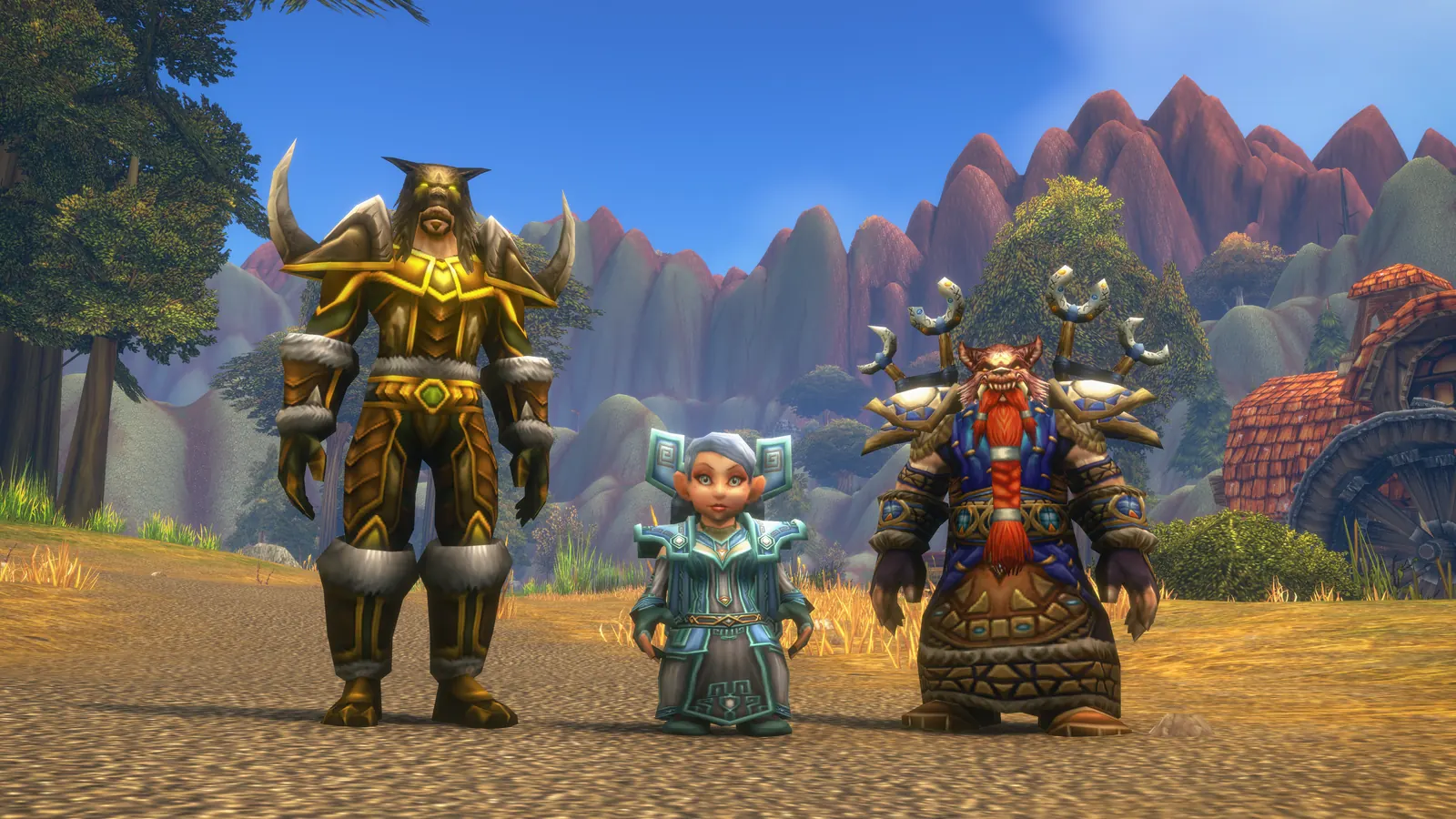 A dwarf shaman, a gnome priest and a human hunter standing together in Dun Morogh, three of the new race and class combinations