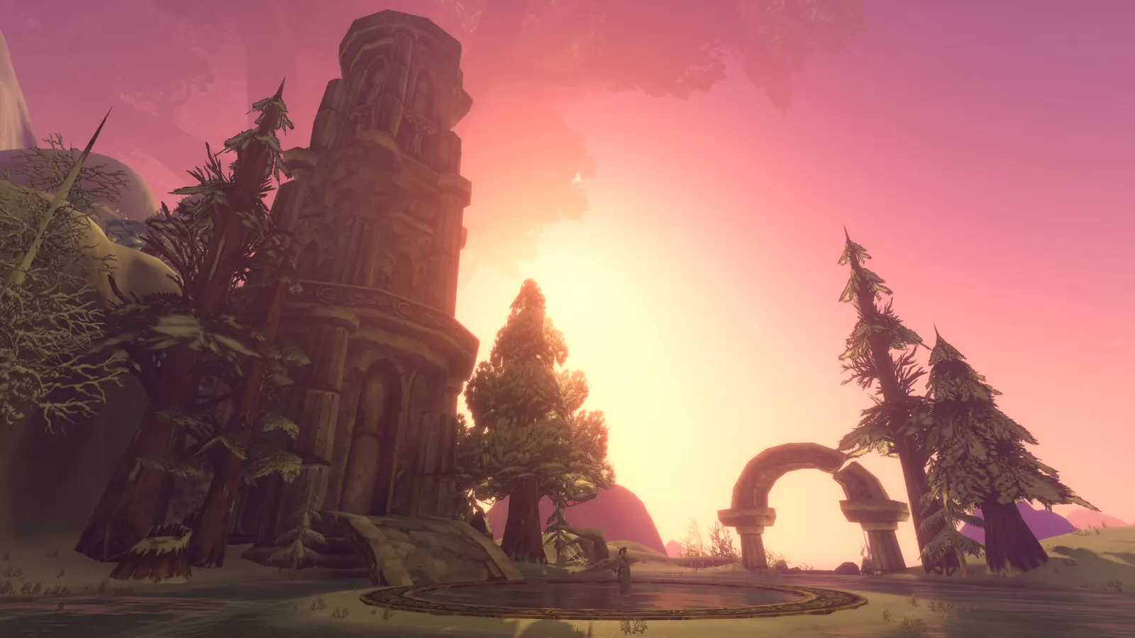 A ruined tower and stone arch on Mount Hyjal against a rose and gold sunset